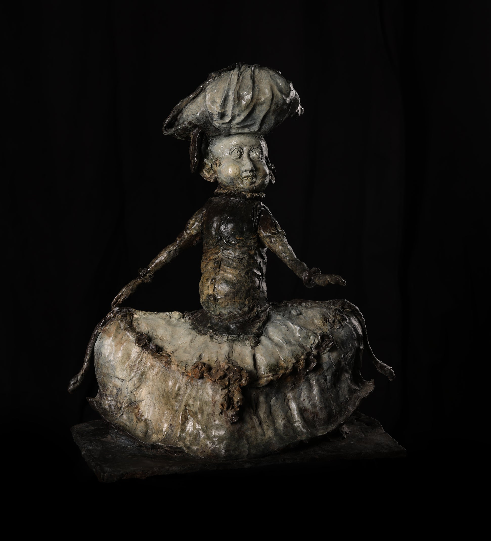 Vintage ceramic figure of a chef on a black background