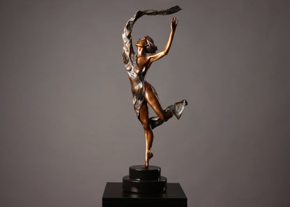 Bronze sculpture of a dancer on a black base against a gray background