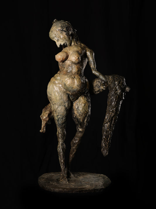 Bronze sculpture of a nude figure with animal features on a black background