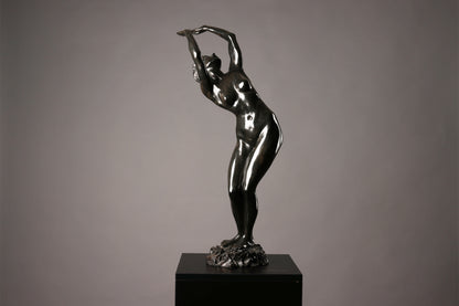 Statue of a dancer on a gray background