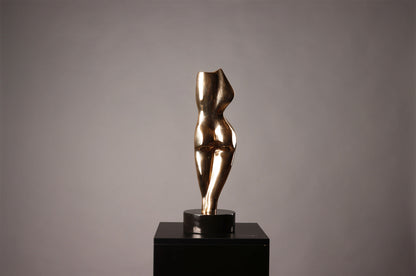 Bronze sculpture of a female figure on a black pedestal against a gray background