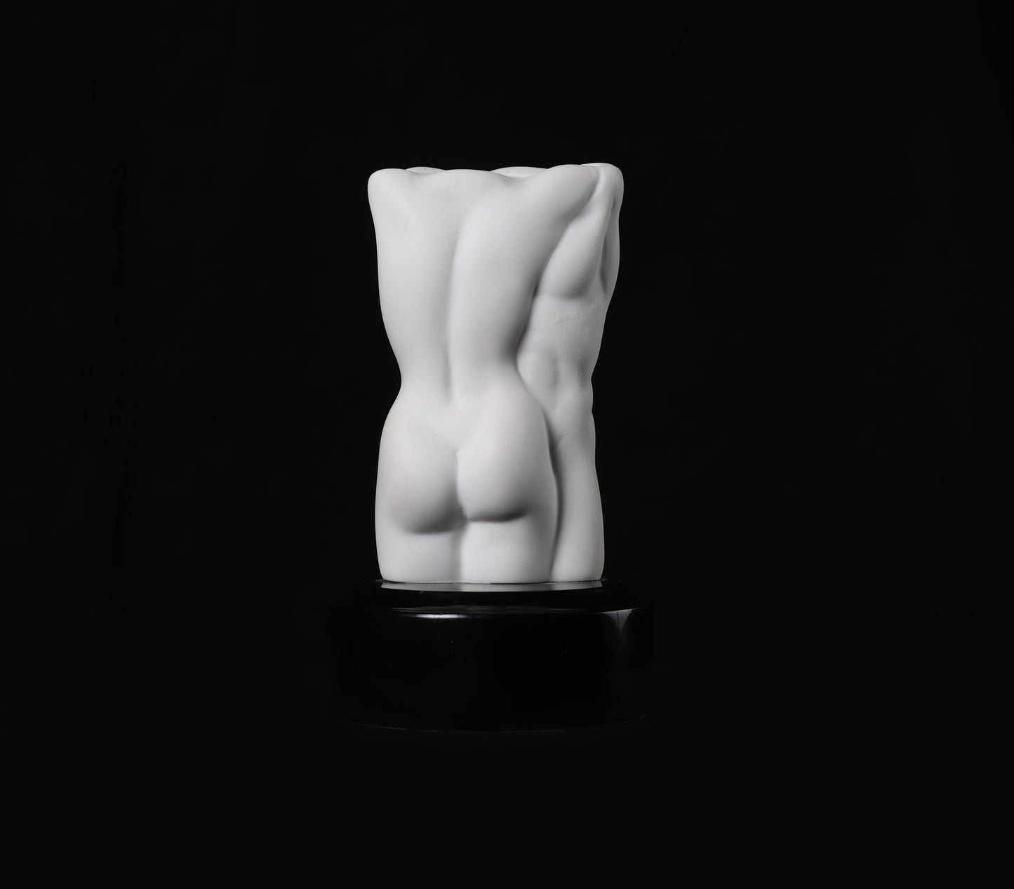 White abstract sculpture on a black background