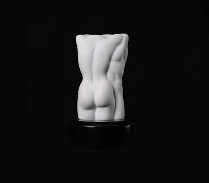 White abstract sculpture on a black background