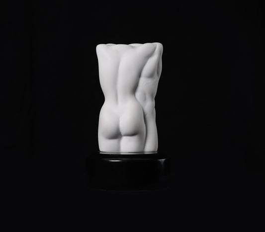 White abstract sculpture on a black background